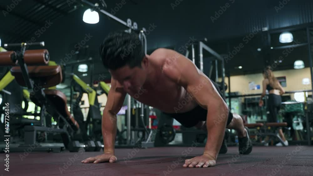 fit sportsman in shirtless doing bodyweight push up exercise in the health club fit sportsman in shirtless doing bodyweight push up exercise in the health club