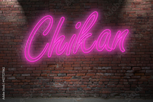 Neon Chikan lettering on Brick Wall at night