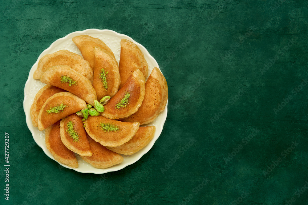 Traditional arabic ramadan sweets qatayef . Middle eastern semolina