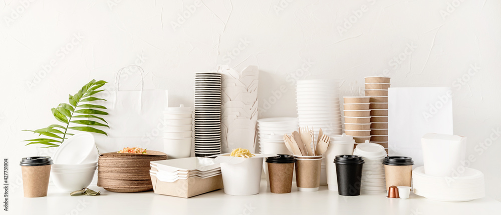 Eco friendly disposable tableware and eating utensils on table - obrazy, fototapety, plakaty 