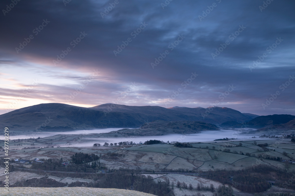 Early morning mist towards Helvellyn Lake Districy UK