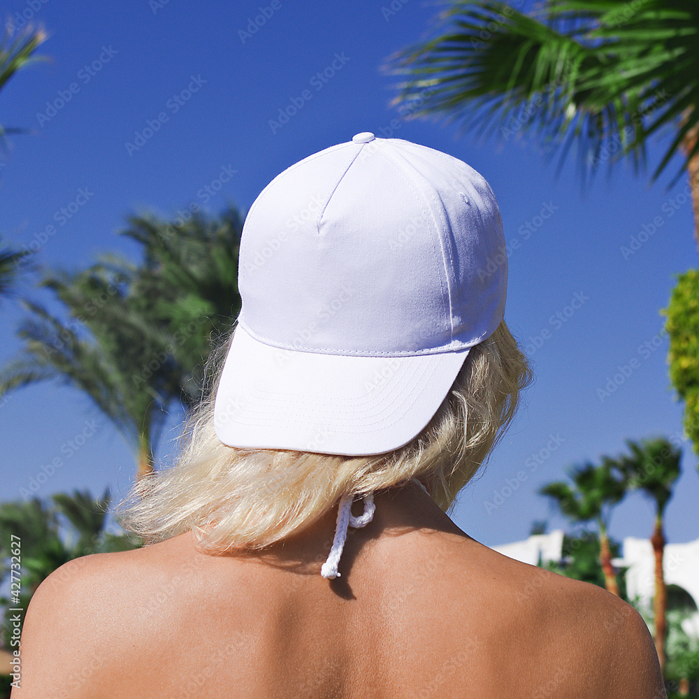 Girl with top baseball cap