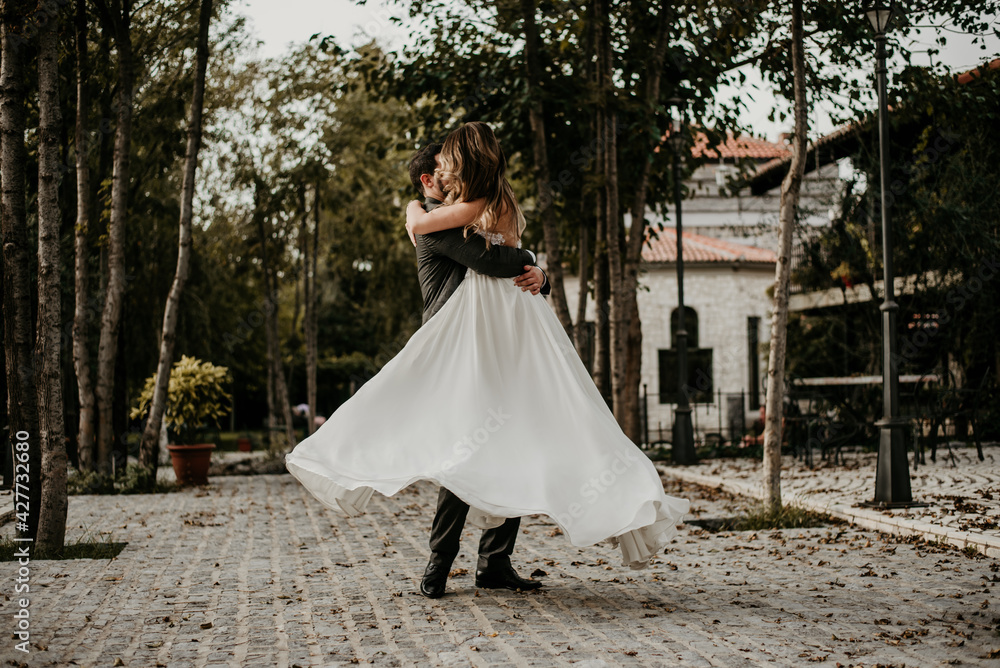 Fototapeta premium bride and groom holding hands wedding dress 