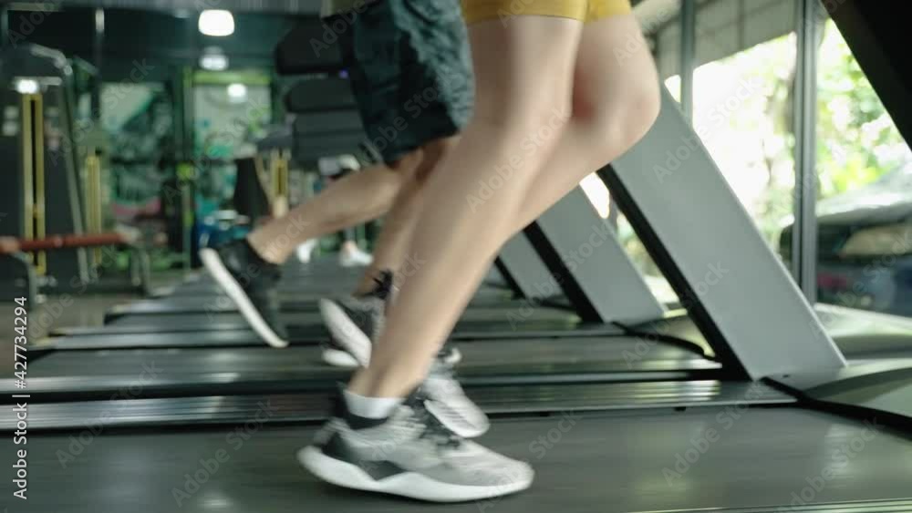 Healthy young people are exercising by running on a treadmill.
Healthy young people are exercising by running on a treadmill.