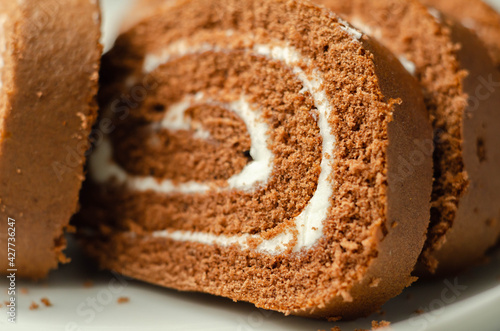 Chocolate sponge roll with a vanilla flavour filling, chocolate swiss roll