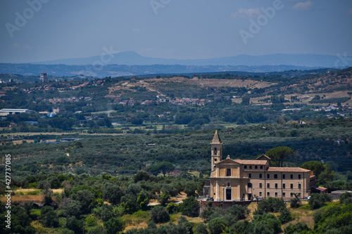 Beautiful view to church and mountains in Tivoli, Italy.