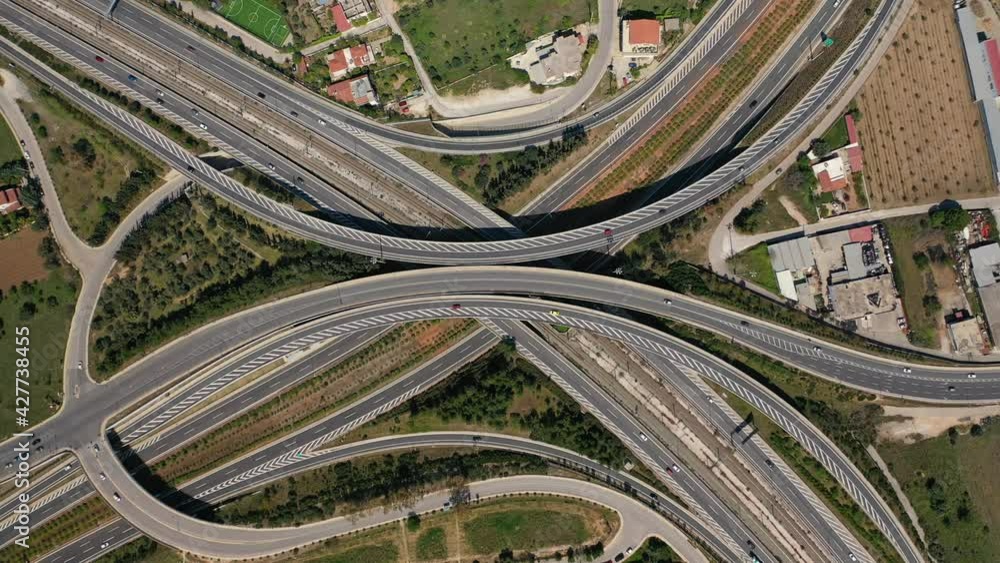 Aerial drone tideo of multilevel highway crossing junction intersection outside urban city center Aerial drone tideo of multilevel highway crossing junction intersection outside urban city center