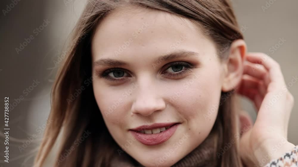 Closeup face of beautiful blond sexy smiling woman with long hair. Portrait of gorgeous girl looking to camera Closeup face of beautiful blond sexy smiling woman with long hair. Portrait of gorgeous girl looking to camera
