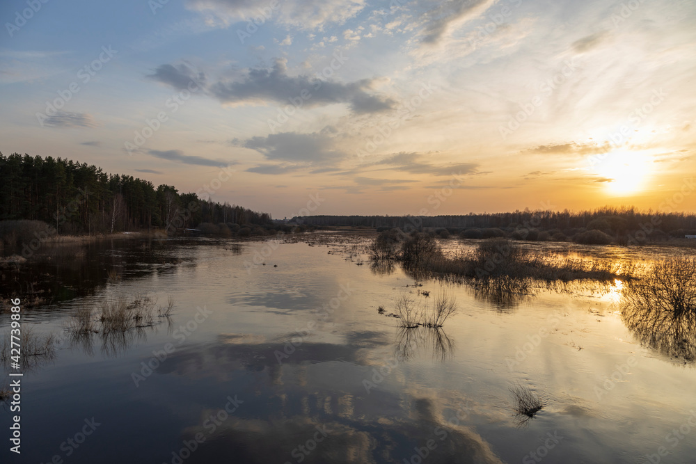 Sunset over the flooded area of the Nerskaya River.