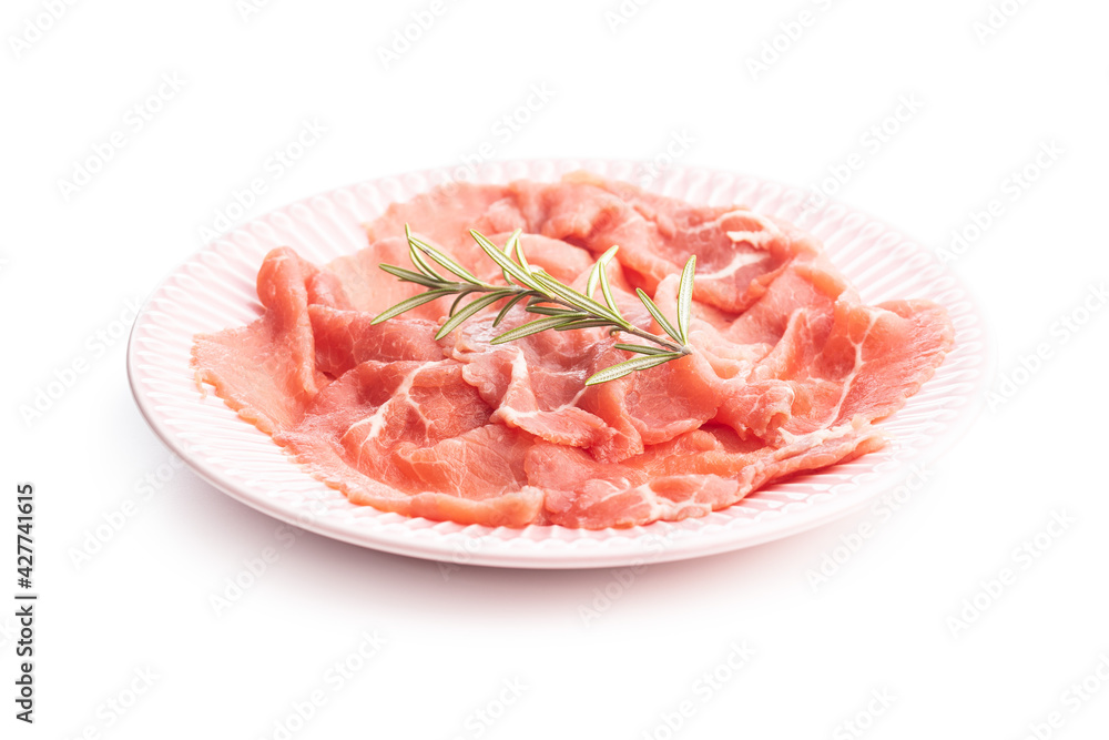 Sliced carpaccio. Raw beef meat on plate.