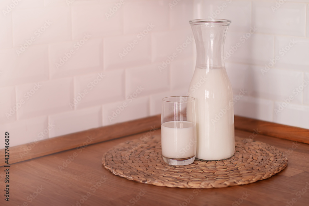 Happy Day of Milk. Milk jug and glass on light background Happy Day of Milk. Milk jug and glass on light background