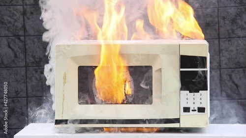 Microwave oven caught fire and caused domestic fire.