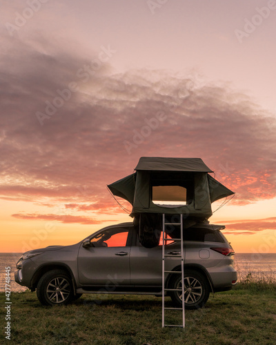 Sunset on the beach camping in vehicle