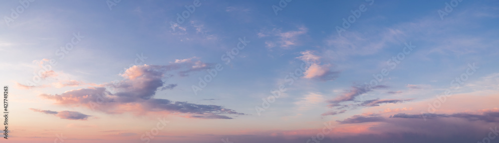 panorama of a bright dramatic twilight sky, beautiful clouds at dawn