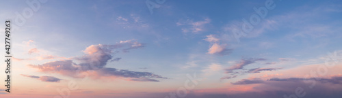 panorama of a bright dramatic twilight sky, beautiful clouds at dawn © yelantsevv