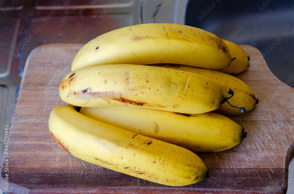 a bunch of bananas over table a bunch of bananas over table