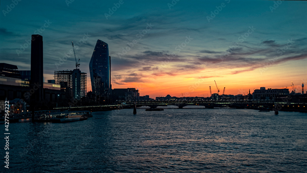 Sunset over The River Thames and The Millennium Bridge, London England
