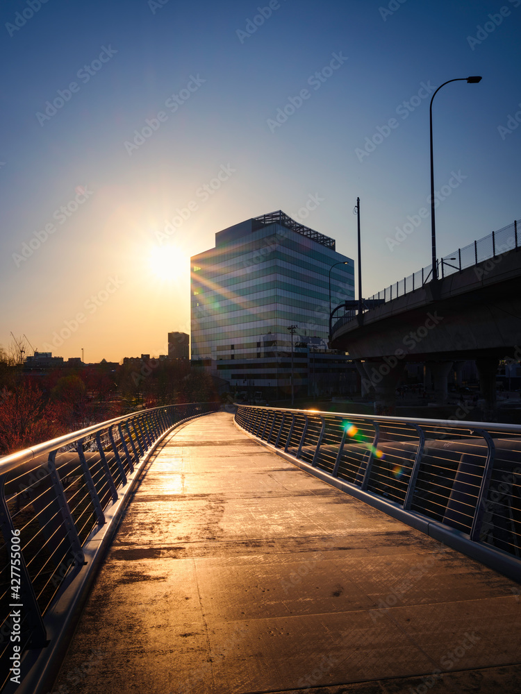 Glowing Sunrays over the Empty Pedestrian Footbridge over the North Point Park in Boston