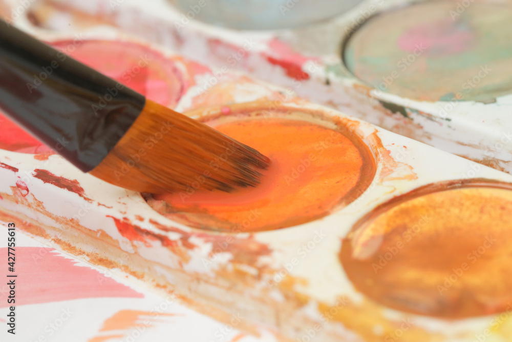 Obraz premium Close up image of a paint brush. Creative hobby or art therapy concept.