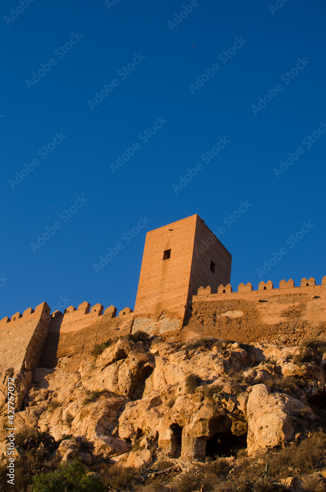 tower and fortified wall on a rock, Alcazaba de Almeria, Andalucia, Spain tower and fortified wall on a rock, Alcazaba de Almeria, Andalucia, Spain