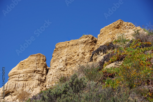 Coastal bluffs under blue sky in Santa Barbara near the harbor