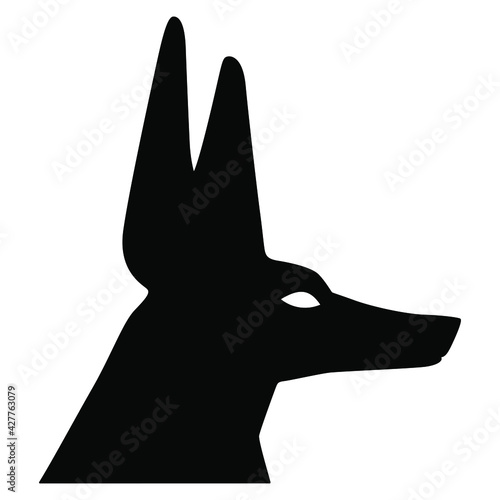 Head of ancient Egyptian jackal or canine headed god Anubis. Black and white silhouette.