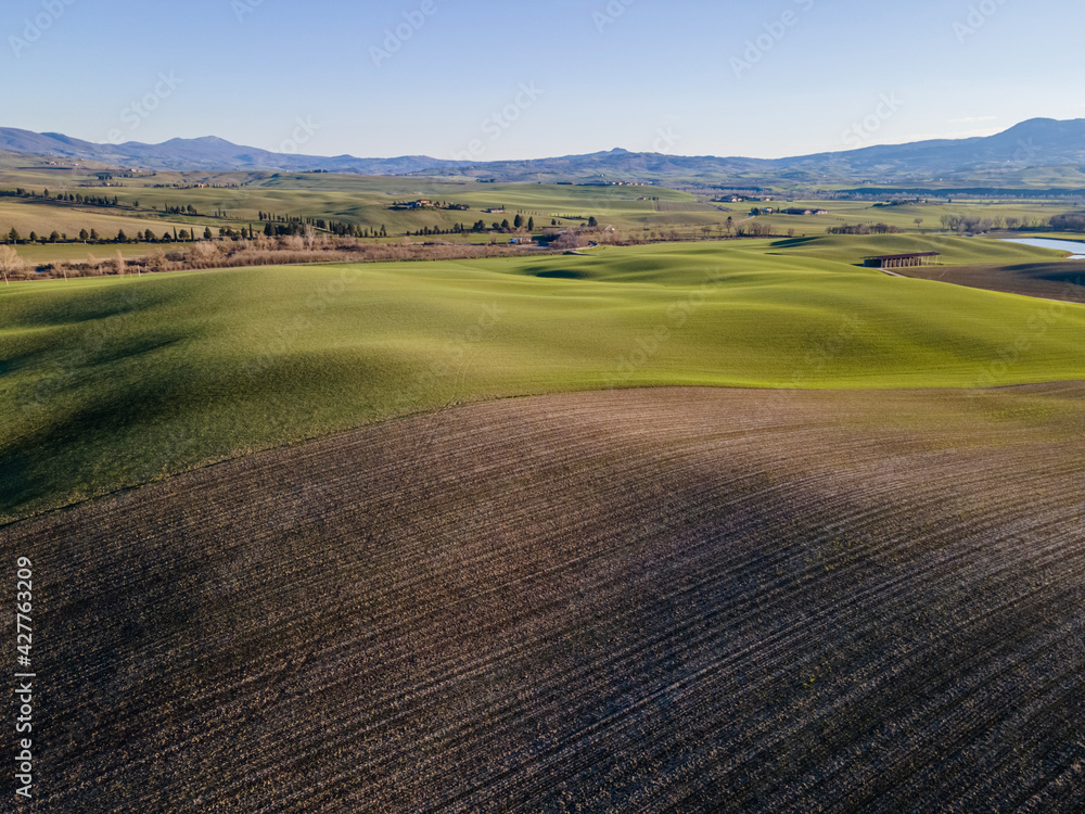 Scenic view of an idyllic countryside with rolling hills.  Aerial view, drone shot.