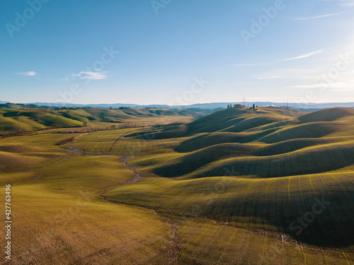 Peaceful and relaxing countryside landscape in Tuscany. Aerial view, drone shot. 