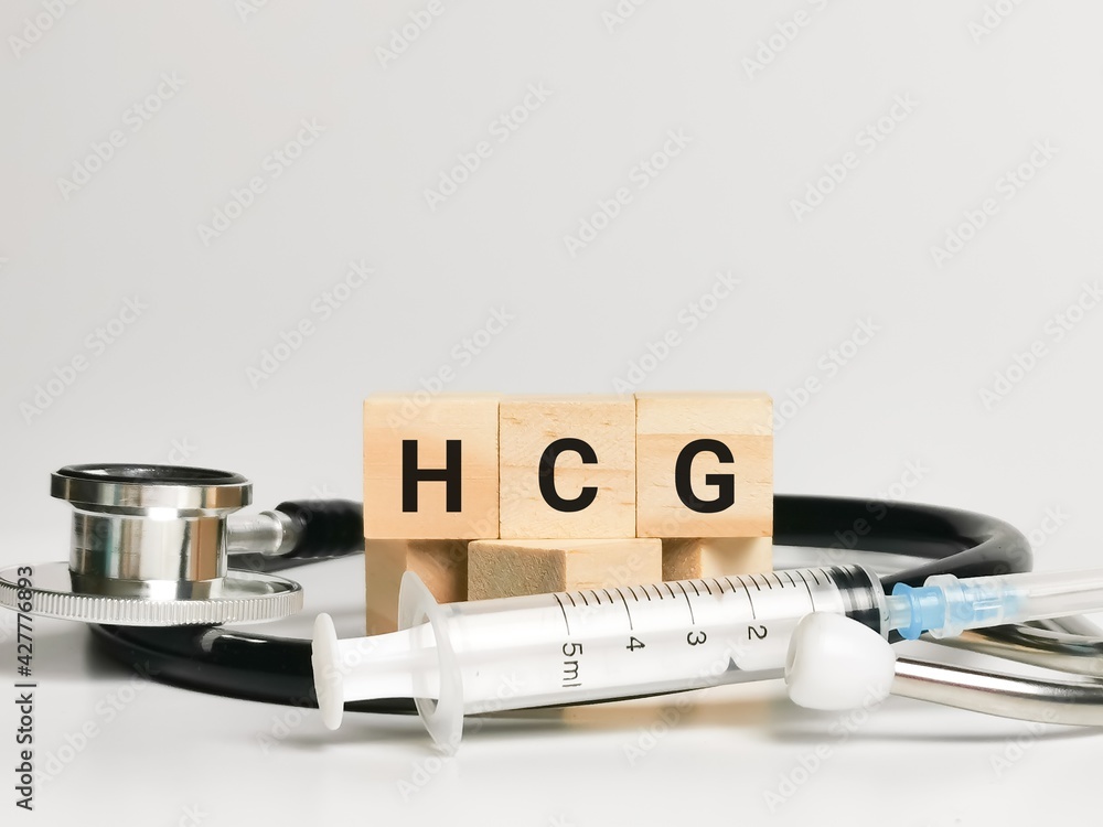 Phrase HCG written on wooden cubes with stethoscope and syringe. Medical  and health concept. foto de Stock | Adobe Stock