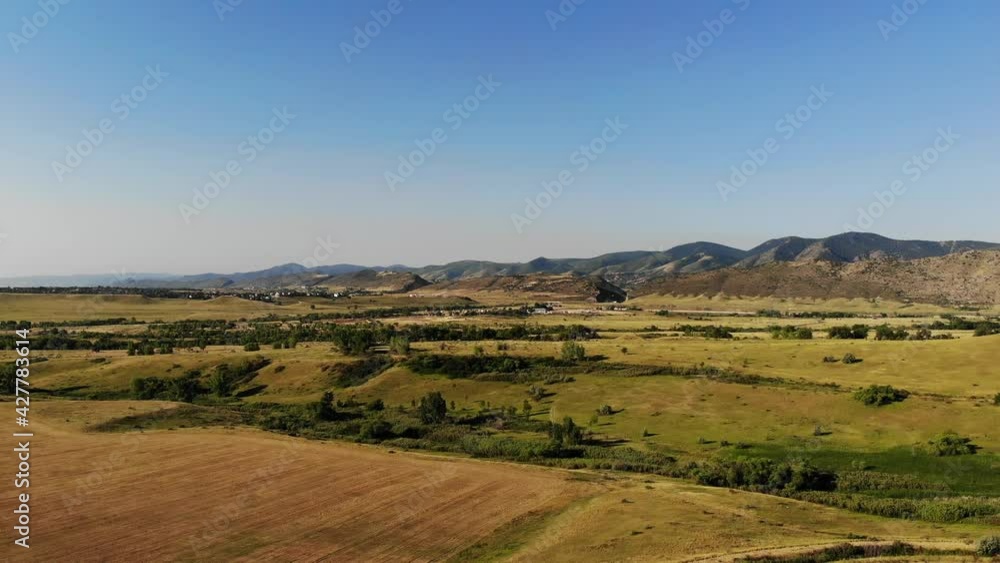 A reverse pan drone shot over a residential open space outside of Denver Colorado A reverse pan drone shot over a residential open space outside of Denver Colorado
