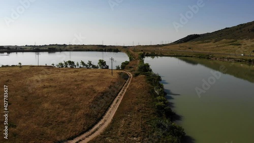Wallpaper Mural A reverse pan drone shot over man made lakes.  Torontodigital.ca