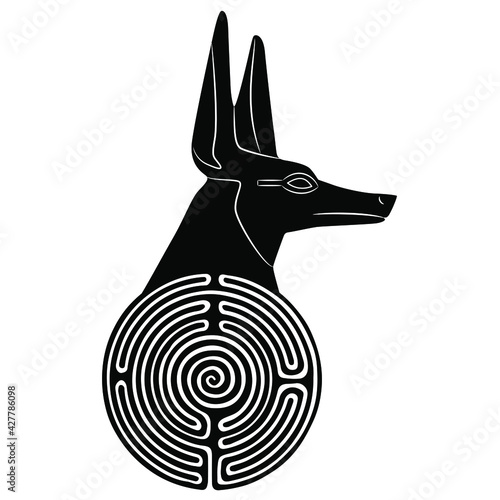 Head of ancient Egyptian canine headed god Anubis on top of round spiral maze or labyrinth symbol. Black and white silhouette. Creative concept for hidden sacred knowledge.