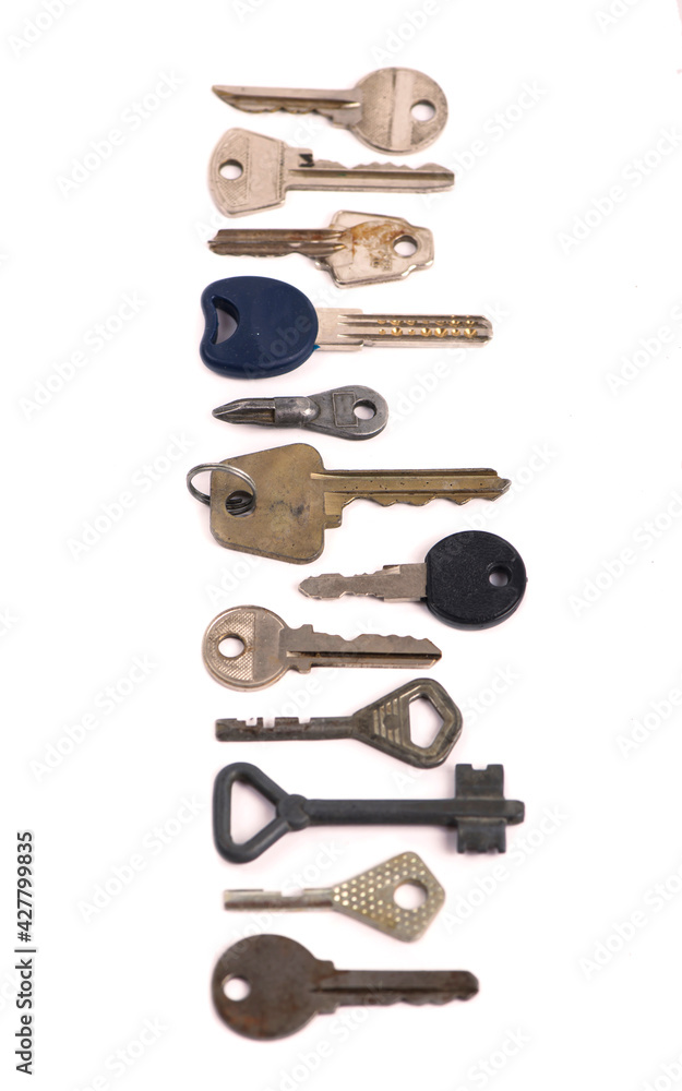 overhead of many different keys in oder on a white background concept overhead of many different keys in oder on a white background concept