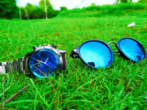 A luxury set of watch and sunglasses