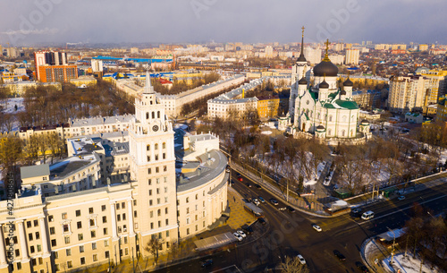 Top view of the Annunciation Cathedral and the tower of the Southern Railway building on the central street of the ..city Revolution Avenue in Voronezh in winter, Russia