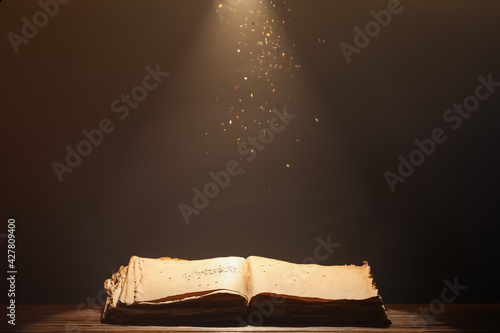 Open old book on table agai...