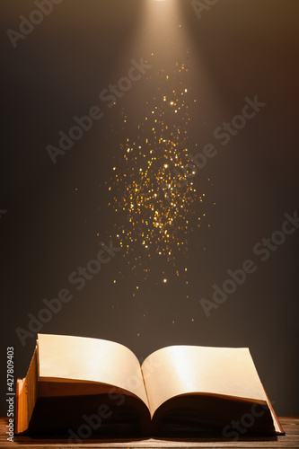 Open old book on table agai...