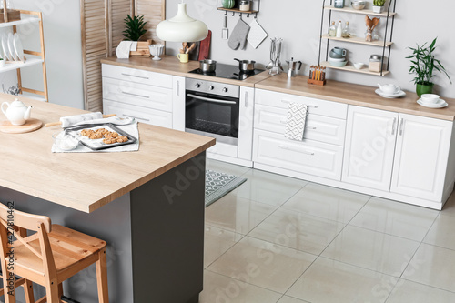 Table in stylish interior of modern kitchen