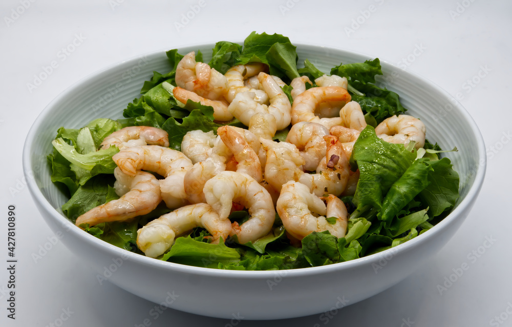 Fresh shrimp salad with lettuce on white dish. Fresh shrimp salad with lettuce on white dish.