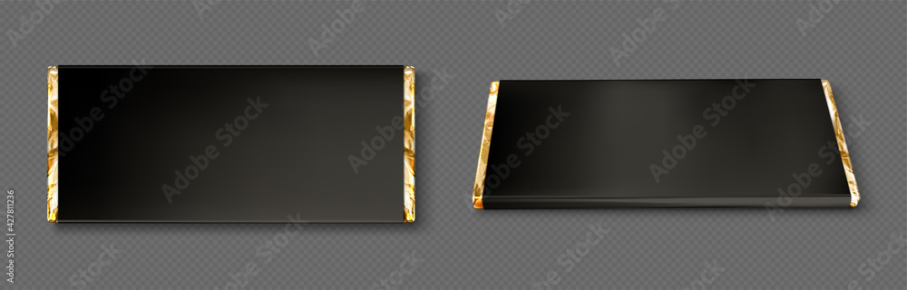 Squares of chocolate in gold wrapper stock photo - OFFSET