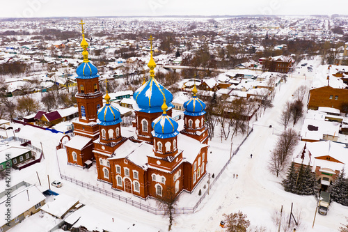 Aerial view of Russian town of Petrovsk in Saratov Oblast with Cathedral of Intercession of Holy Virgin on winter day. photo