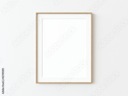 Light wood thin rectangular vertical frame hanging on a white textured wall mockup, Flat lay, top view, 3D illustration