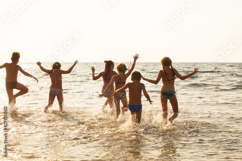 A group of young people dancing on the ocean