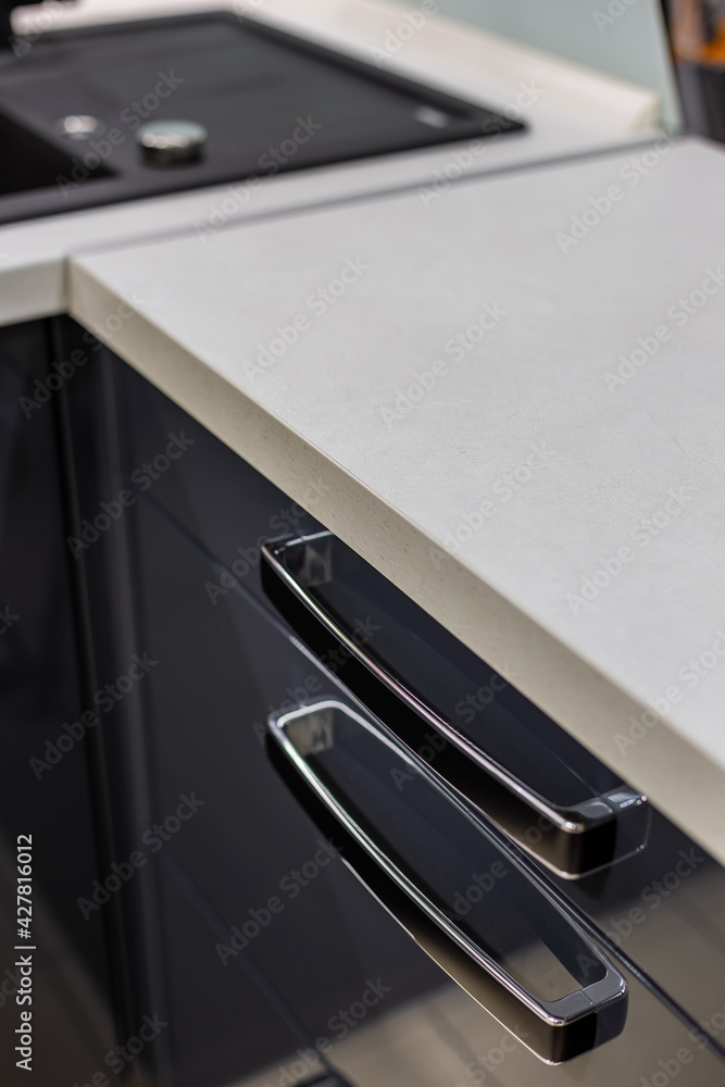 Original innovative kitchen cabinet handles. Kitchen design.