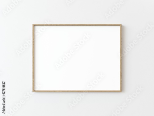 One light wood thin rectangular horizontal frame hanging on a white textured wall mockup, Flat lay, top view, 3D illustration