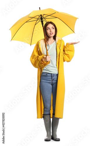 Stylish young woman in rain...