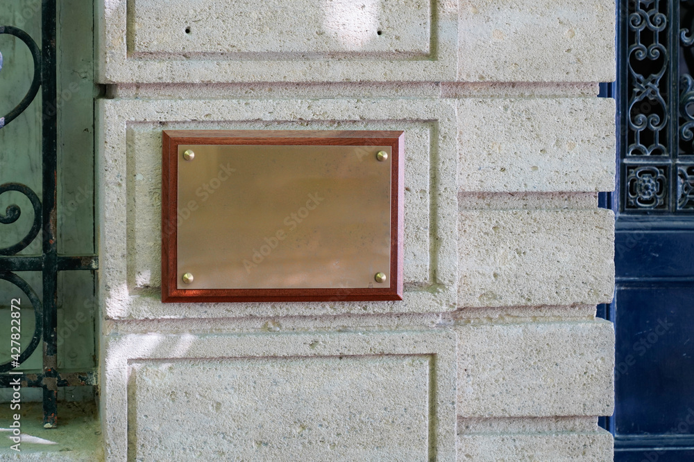 empty copper blank plate on the entrance signboard on textured wall mockup for notary doctor office empty copper blank plate on the entrance signboard on textured wall mockup for notary doctor office