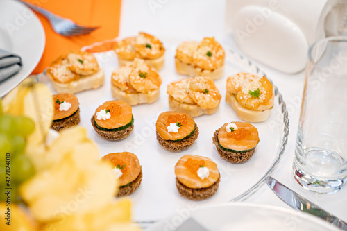 canapes. A convenient buffet feed. little sandwiches at the festival. Catering. delivery of ready meals and service of banquets.