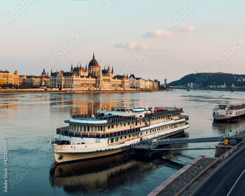 Hungarian Parliament and a big boat. photo about famous part of Budapest city. Amazing photo about the Hungarian government's building. © GezaKurkaPhotos