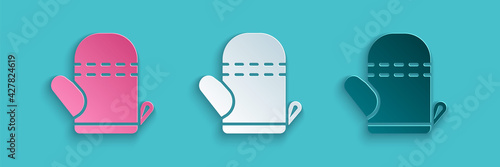 Paper cut Oven glove icon isolated on blue background. Kitchen potholder sign. Cooking glove. Paper art style. Vector